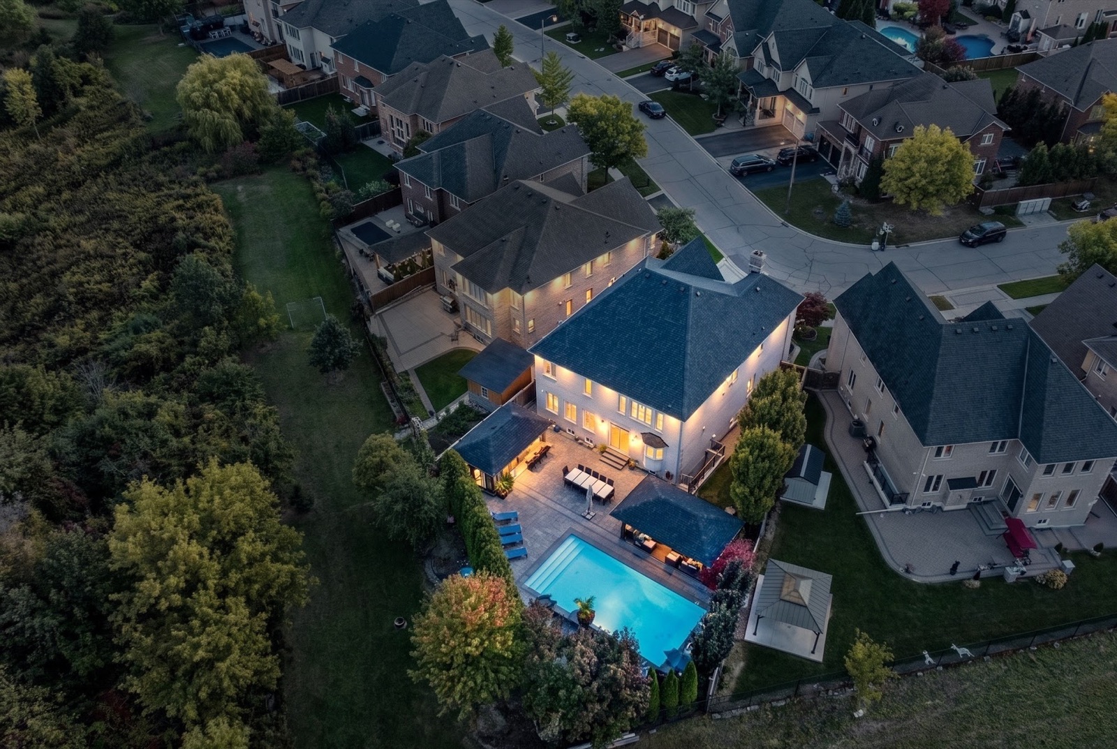 Backyard and pool at twilight